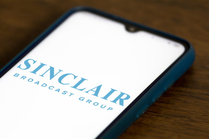 In this photo illustration the Sinclair Broadcast Group logo